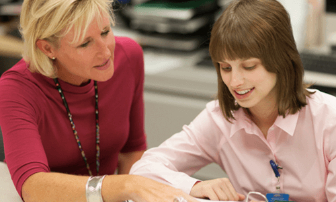Young woman working with job coach