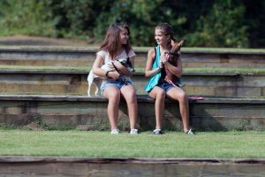 Girls talking at a park.
