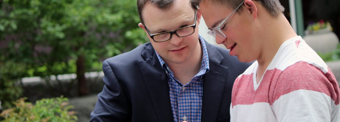 Men with Down syndrome talking.